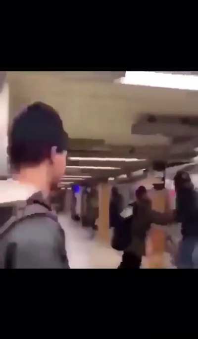 Dude spits on train passenger and gets a beatdown for it.