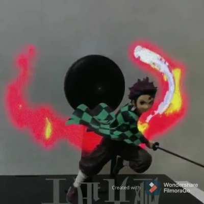 Demon Slayer figure with an animated background