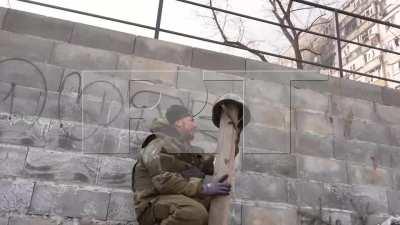 [Ukraine] DPR militiaman baiting Ukrainian sniper fire with a helmet on a board