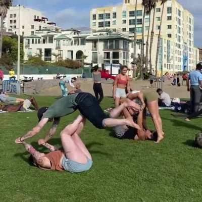 My boyfriend and I trying to fit in at yoga on the beach.