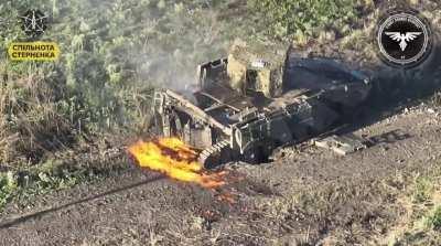 A lone Russian IFV is running over a RAAMS mine and is later getting finished off by a Ukrainian FPV quad.