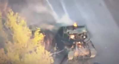 Russian Tank Crewman Hit By Kamikaze Drone Escaping His Tank.