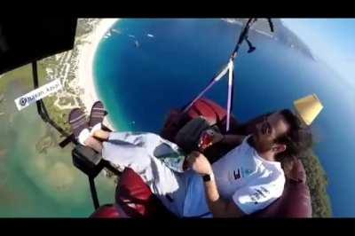 Man attempts to paraglide with couch