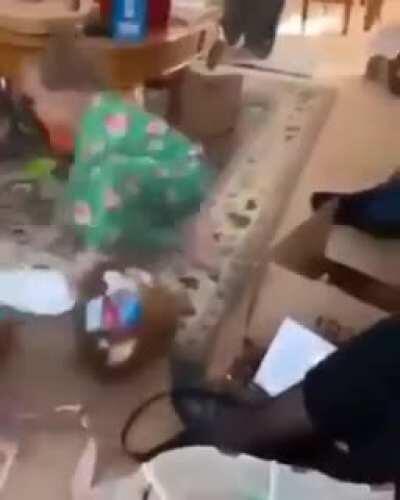 Little kid ground-stops Easter egg to get the goodies inside.