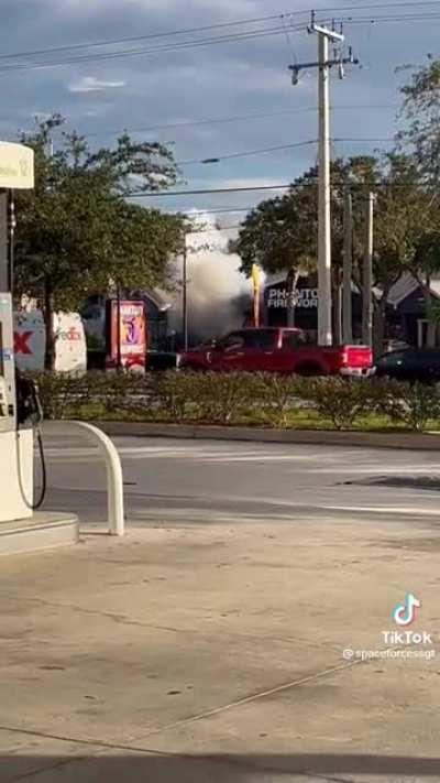 Car drives into fireworks store, sparks fly.