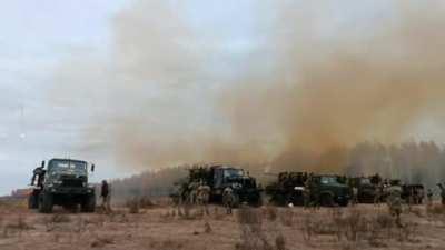 Ukrainian S-60 anti-aircraft guns are mounted on trucks, conducting practice firing.