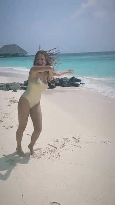 Dancing in bikini.