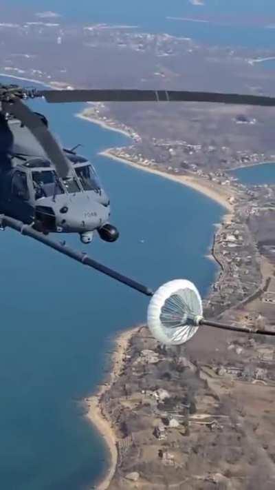 This is how helicopters refuel in midair.