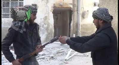 FSA fighters are almost shot during an intense battle with regime forces. Irbin, Syria. 1/03/2013.