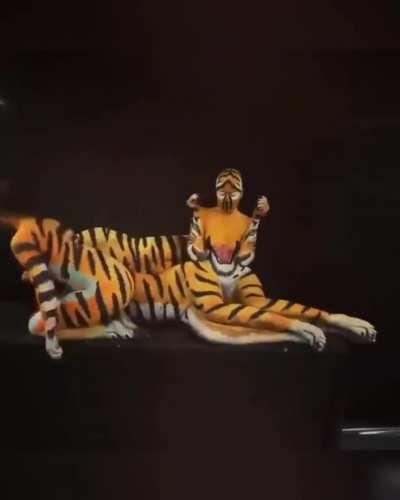 Women formed an amazing Tiger body paint Illusion