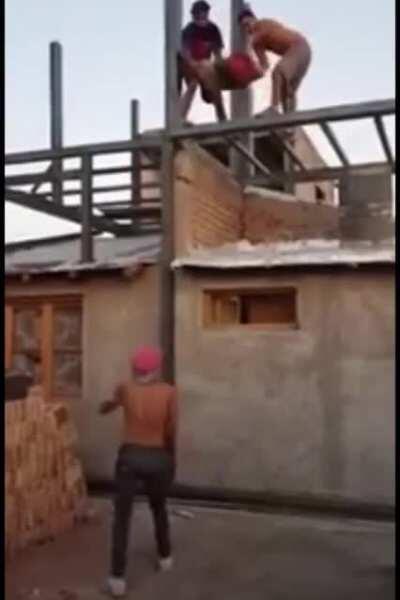 Catching bags of cement from a roof