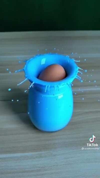 Ever wondered what an egg falling into paint would look like? No, me neither