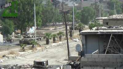 Opposition fighters engage an SAA tank from the rear - Daraa - 6/16/2013