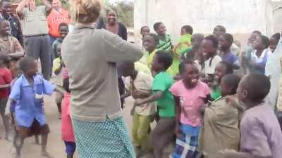 African children hearing fiddle music for the first time.