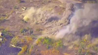 Ukrainian drone footage of an attack on a Russian 2S7 &quot;Pion&quot;  203-mm self-propelled cannon using cluster munitions.