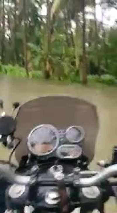 WCG while riding a bike on a flooded road