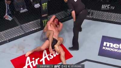 [Video] Georges St-Pierre knocks down and chokes out Michael Bisping to win the middle weight title at UFC 217