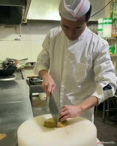 Slicing potato into a thin net