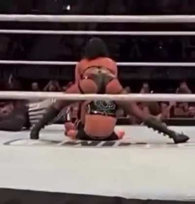 Back view of Rhea pinning Liv