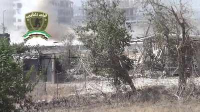 Al-Haq Brigade recoilless team successfully ambushes a fast moving Syrian Army tank in Zamalka - August 2013