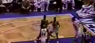 Shaq breaking multiple backboards while dunking.