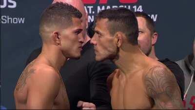 Rafael Dos Anjos stares into the soul of Anthony Pettis (from the UFC 185 pre-fight weigh ins)