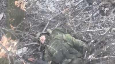 Russian soldier trying to hide from FPV drone not knowing he's being tracked by recon drone