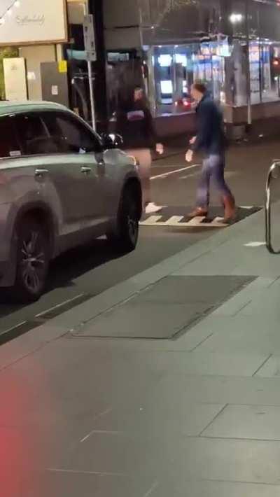 This lovely man walking in the middle of the street