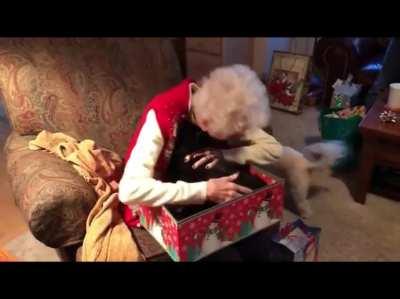 Grandma reacts to getting a cat for Christmas.