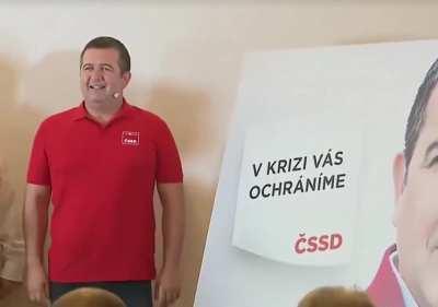 Czech politician unveiling campaign billboard to absolutely no applause.