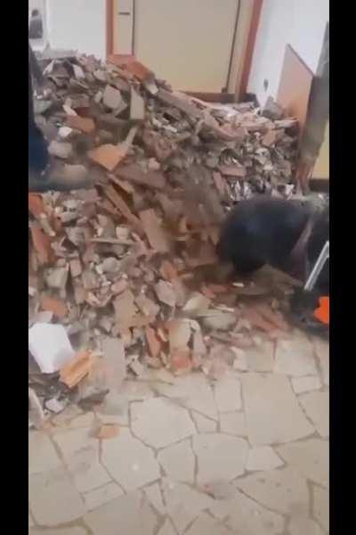 Using vacuum suction to remove the rubble from a Polish construction site