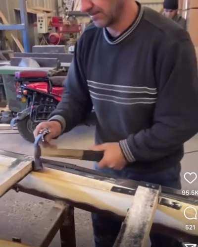 Carpenter hammers dozens of nails in a matter of seconds without missing a single one