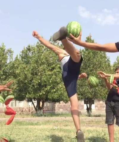 Guy uses acrobatics to explode the melons in sandals