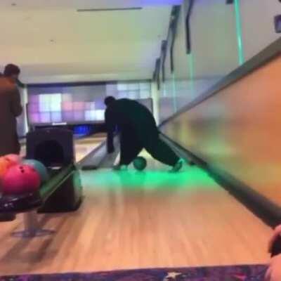 To bowl between the legs