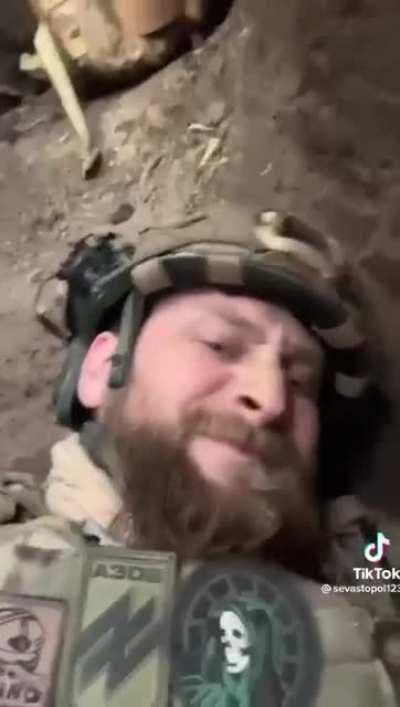 Donetsk Oblast. A Ukrainian soldier records himself hunkering down in a trench when he hears the telltale sign of an incoming shell and braces for impact.