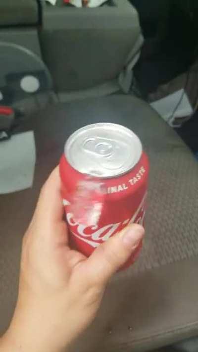 The way the ice cube spins around the can