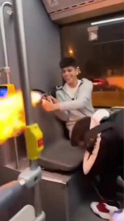 Idiots playing with flamethrower inside public bus