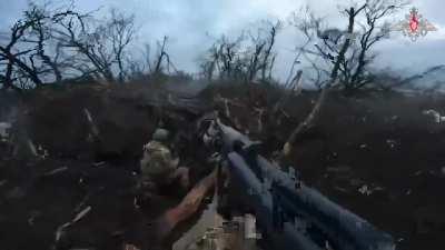 Russian soldiers capture a Ukrainian position.