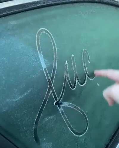 Writing on a frosted window.