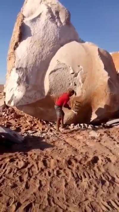 Man splits a giant rock 🪨