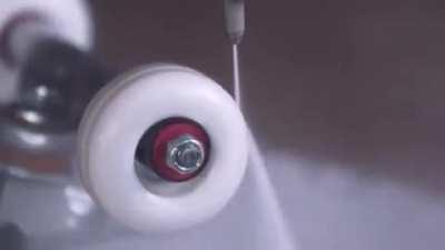 Spinning a skateboard wheel so fast the centripetal force rips it apart