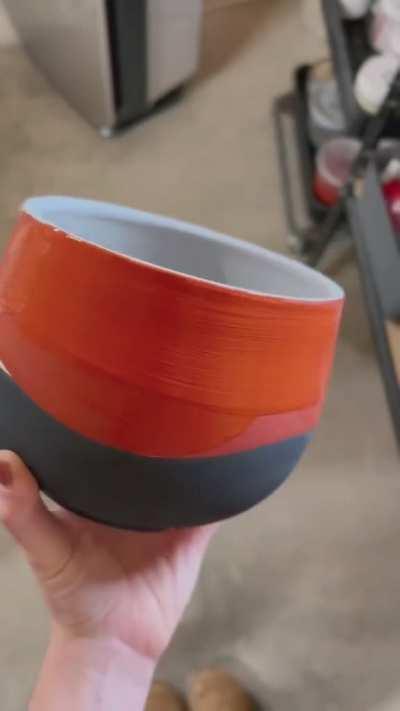 Hand painting a pot