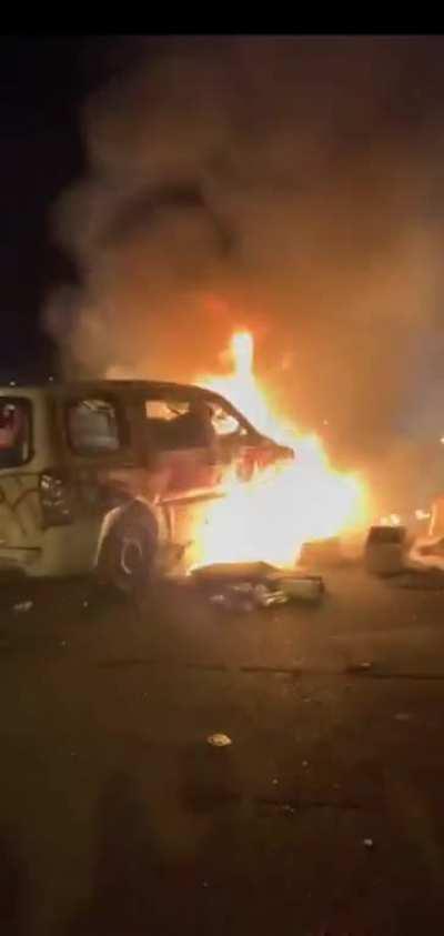 Rioters burns mailman's car