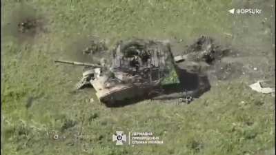 Ukrainian drone destroyed disabled T-90M with multi-story cope cage.