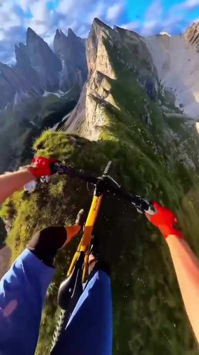 Biking a ridge in the Dolomite Mountains in Italy 