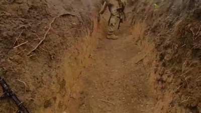 Ukrainian soldiers moving forward in the direction of Melitopol. Footage reportedly from a recently captured Russian trench.