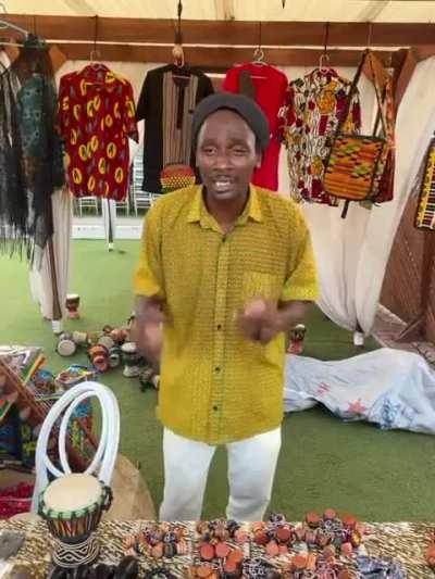 Ghanaian musician Moussa Diarra demonstrating how to play the kush-kosh