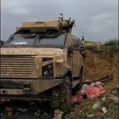 Azerbaijani soldier shooting mortar round from military vehicle during the Karabakh war