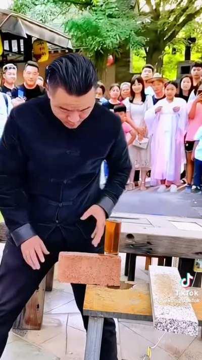 Splitting a brick without spilling a drink