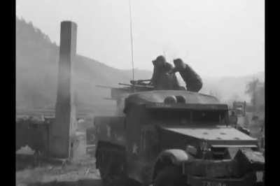 A pair of M16 Multiple Gun Motor Carriages fire on North Korean position in March 1951